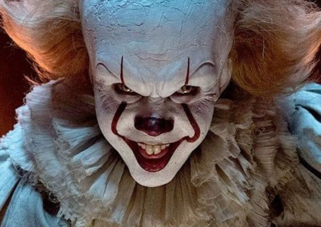 Pennywise horror movie Halloween costume with clown makeup