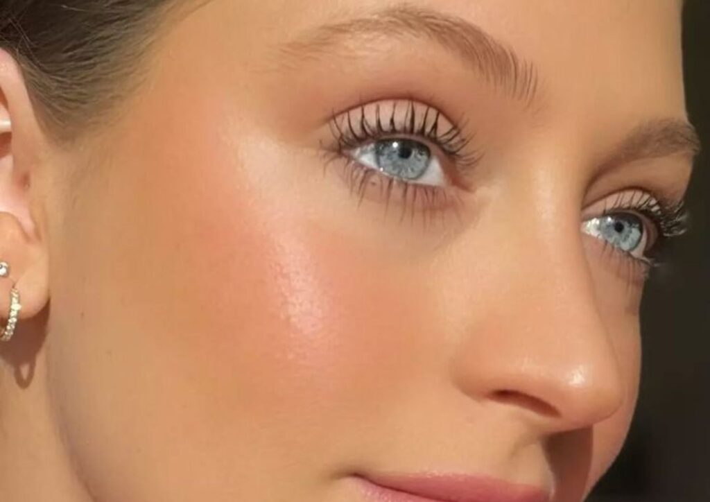 Blush above cheekbones on a round face
