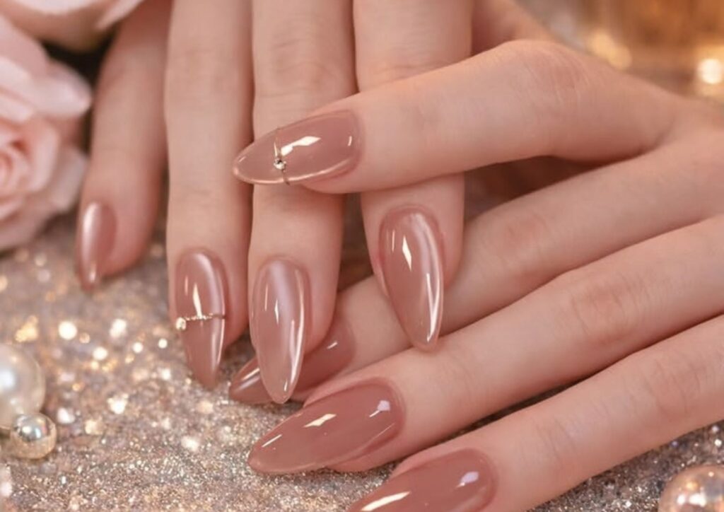 Wedding guest nail ideas with elegant glossy nude nails