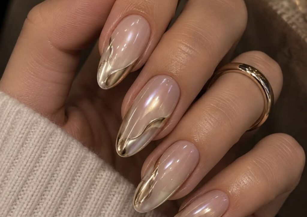 Wedding guest nail ideas with nude nails and delicate gold details