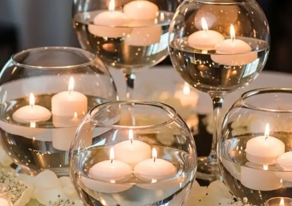 DIY wedding centerpiece ideas featuring floating candles in glass bowls