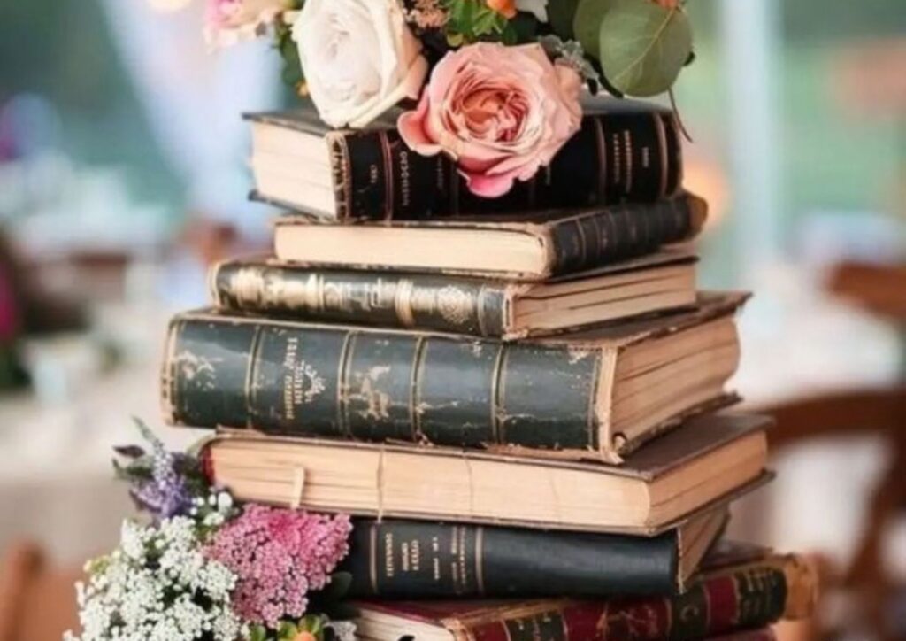 Rustic wedding centerpiece with vintage books and flowers